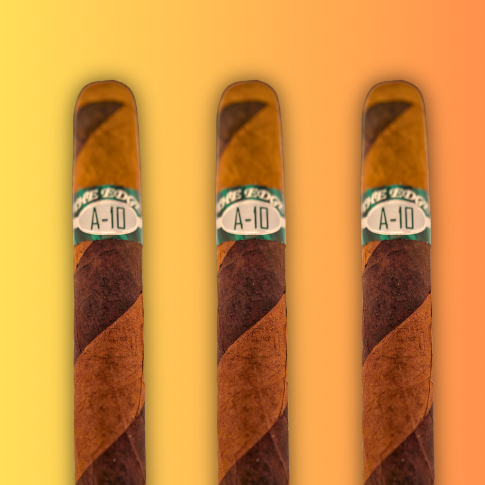 Three Rocky Patel The Edge A-10 10th Anniversary cigars arranged side by side against gradient yellow-orange background, showcasing the barber pole wrapper design and A-10 anniversary bands